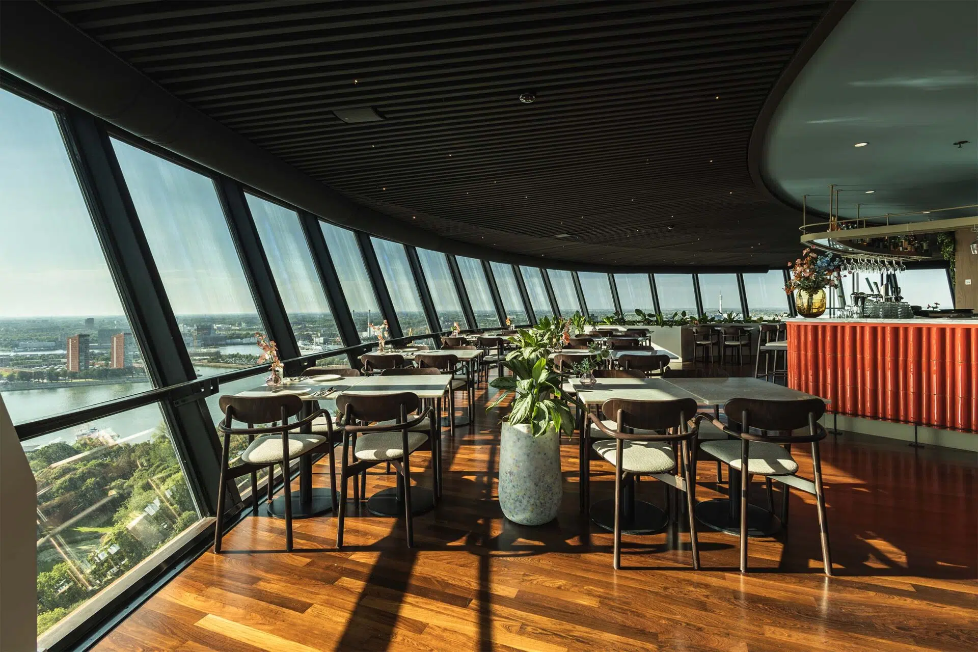 Tables along the curved glass wall of the restaurant in the Euromast in Rotterdam