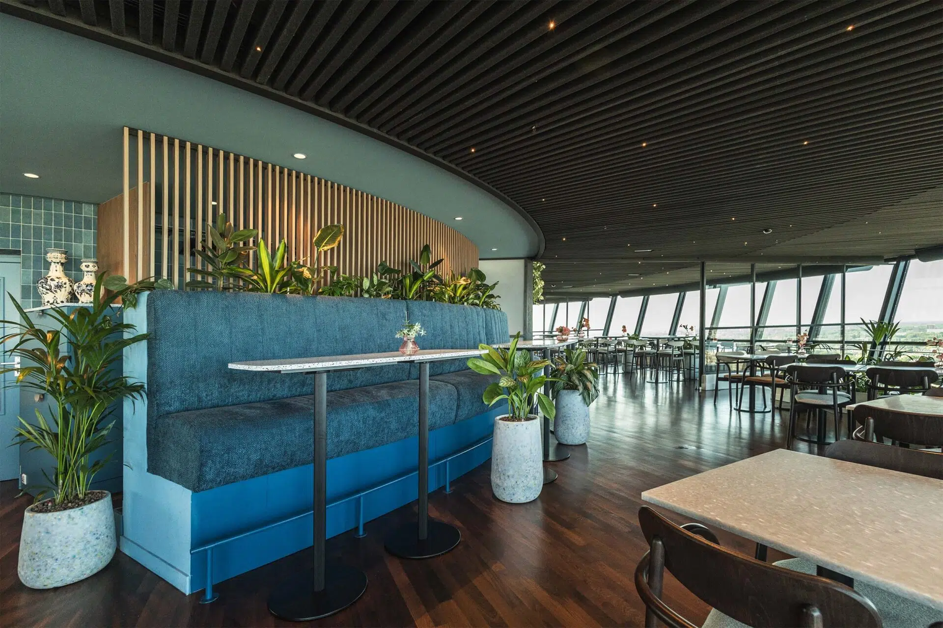 Custom blue bench with planters in the restaurant of the Euromast in Rotterdam